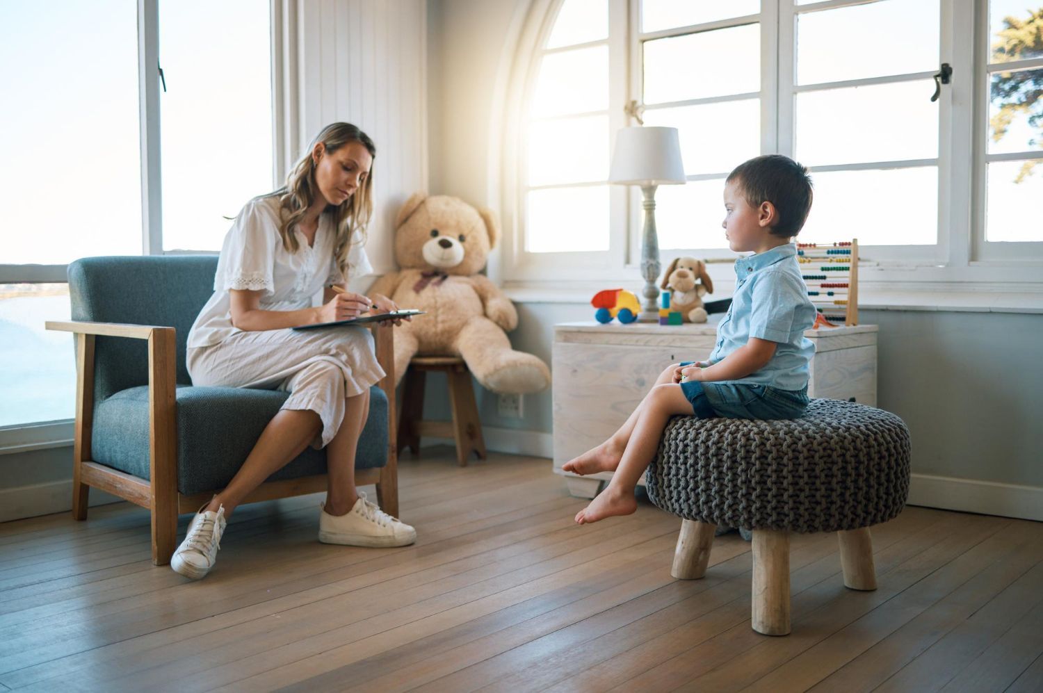 Therapist working with young child in a supportive ABA therapy session